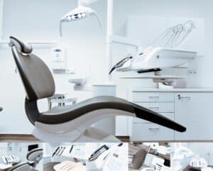 A modern dental clinic interior showcasing a dental chair and equipment in a clean, clinical setting.