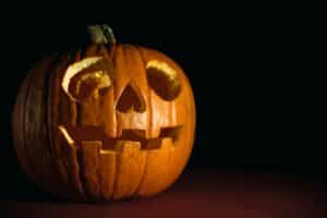 Close-up of a glowing carved pumpkin, perfect for Halloween themes.