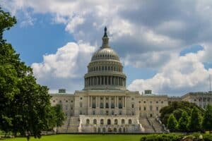 A stunning view of the iconic United States Capitol under a blue sky in Washington, D.C.
